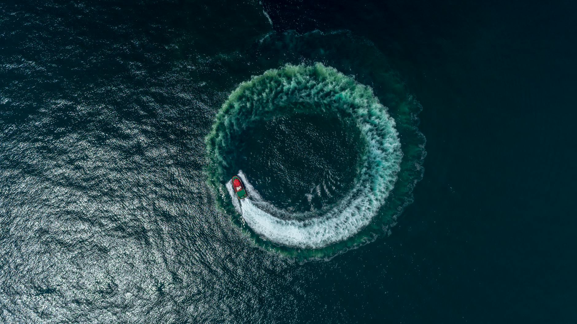 Image of a boat making a circular pattern in the water